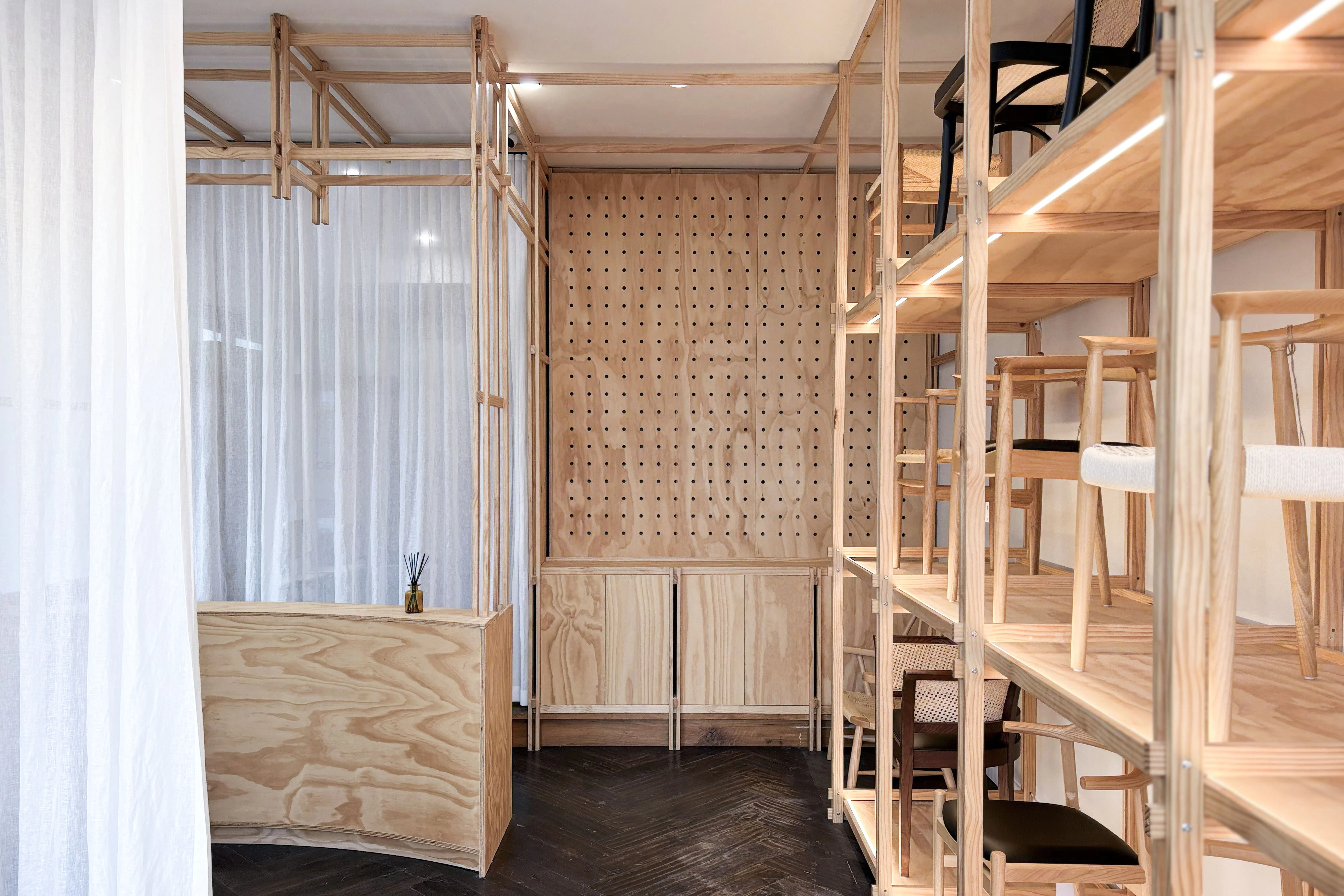 Richmond showroom shelving arranged to support furniture, objects and changing displays.
