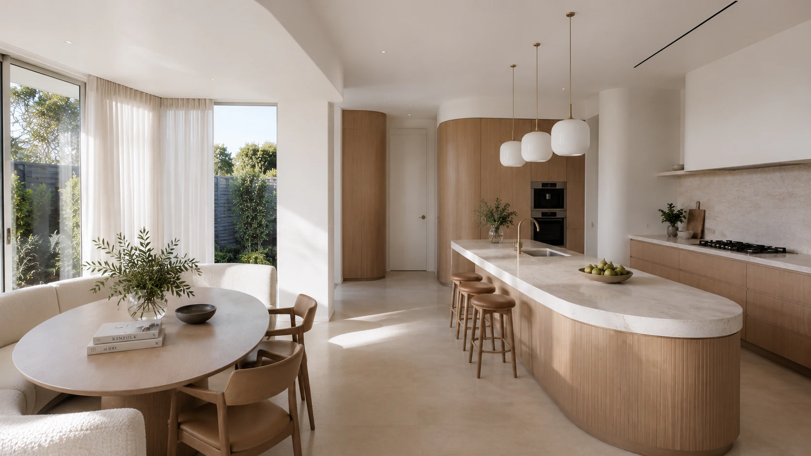 Kew Residence kitchen with a sculpted island and integrated timber cabinetry.