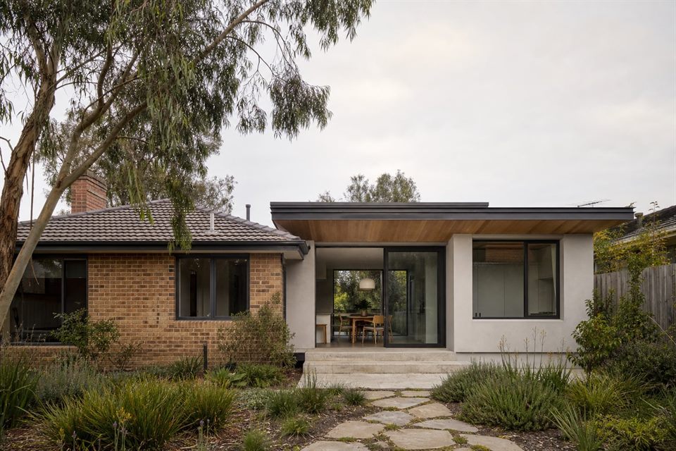 Contemporary rear extension joined to an existing Melbourne brick veneer house.